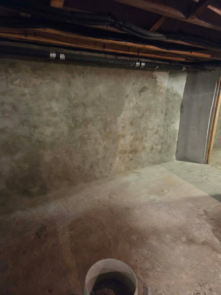 Interior basement waterproofing installation in Appleton, WI (photo 1)