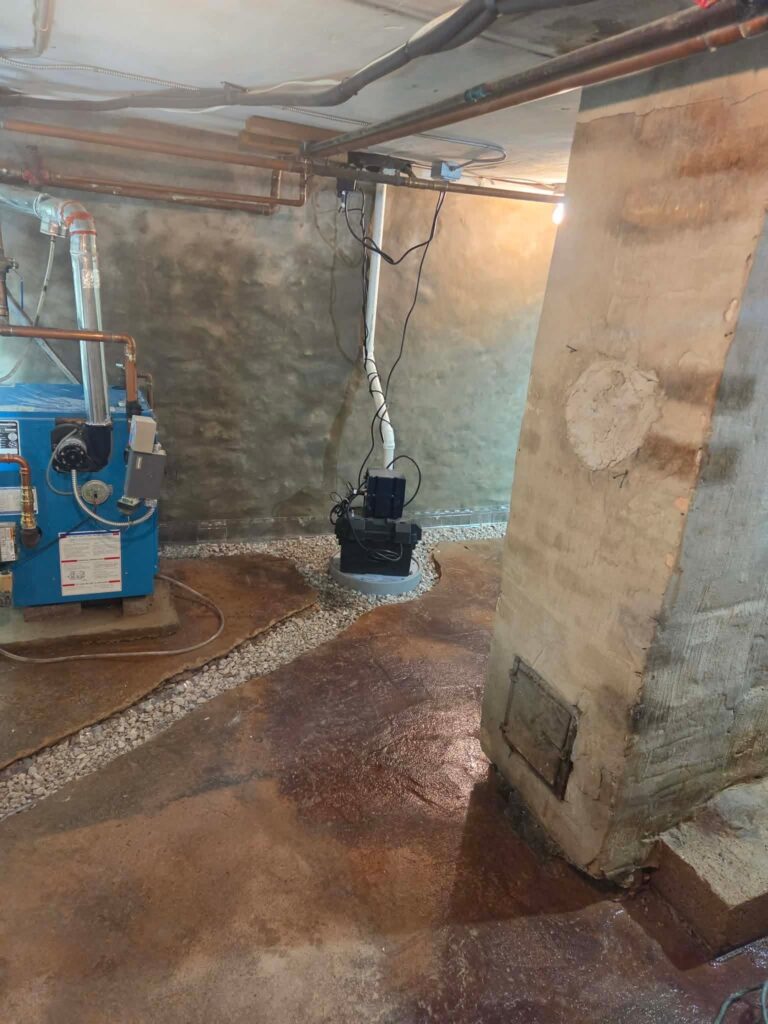 Interior basement waterproofing installation in Appleton, WI (photo 3)