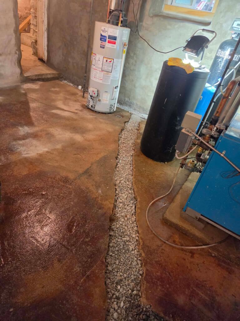 Interior basement waterproofing installation in Appleton, WI (photo 6)