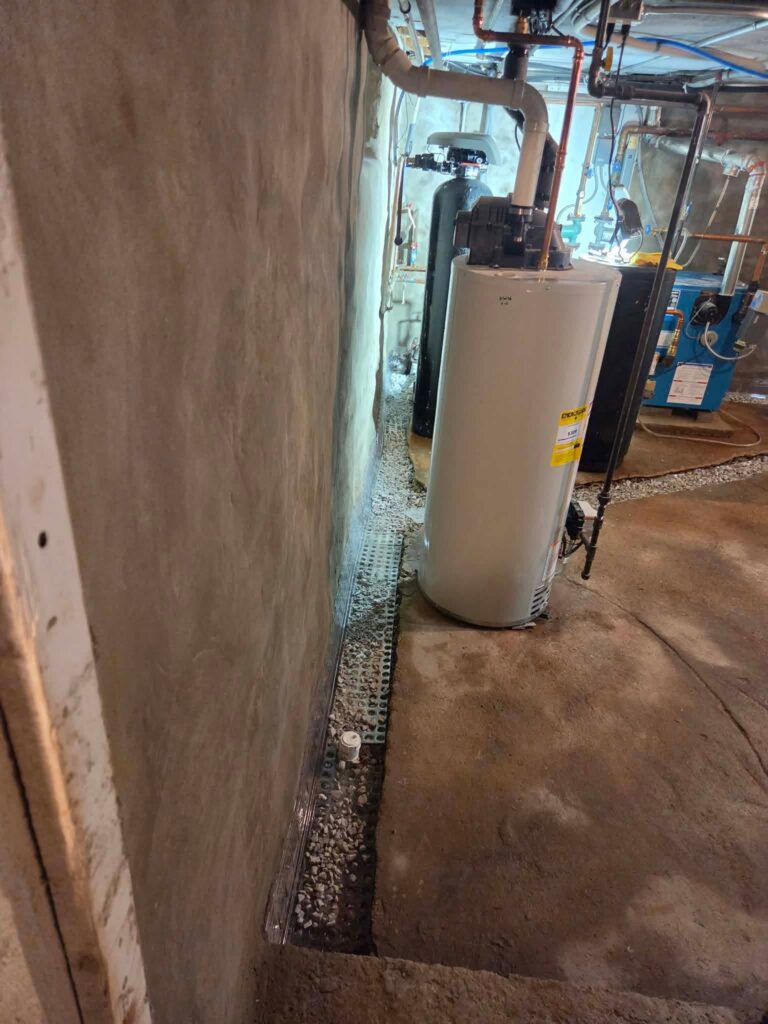 Interior basement waterproofing installation in Appleton, WI (photo 7)