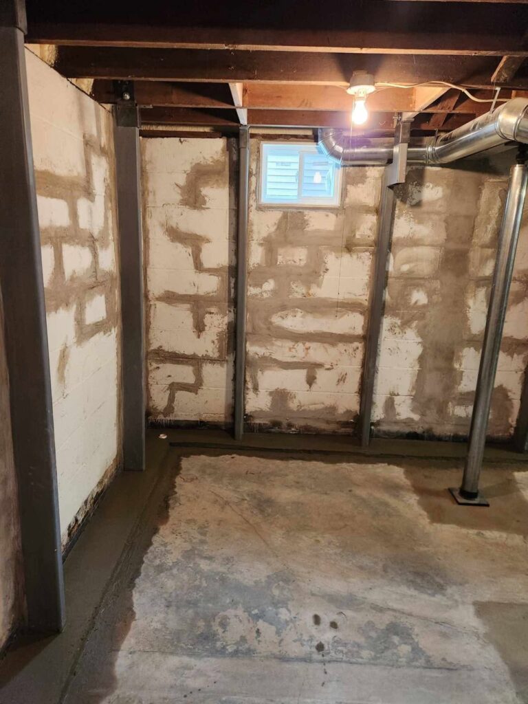 Interior basement waterproofing and foundation repair project in Menasha, WI (photo 10)