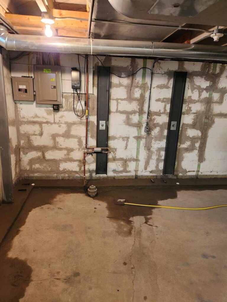 Interior basement waterproofing and foundation repair project in Menasha, WI (photo 12)