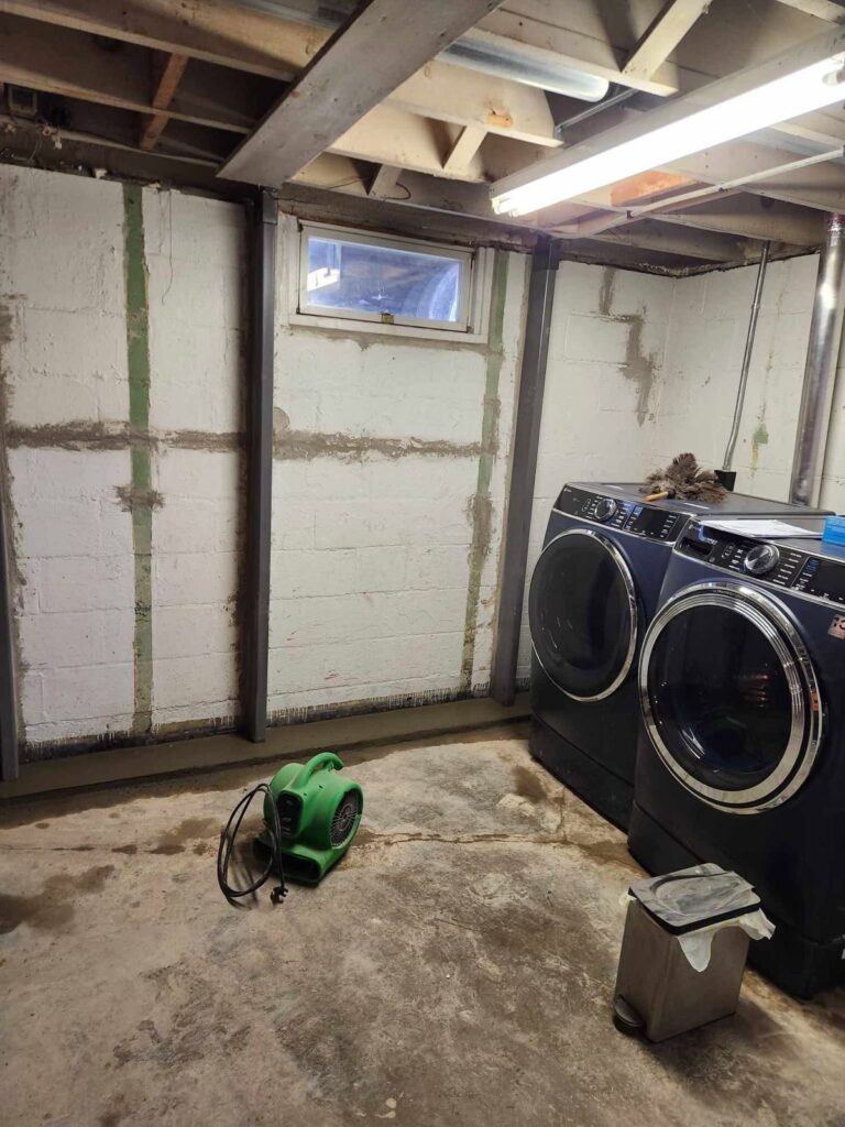 Interior basement waterproofing and foundation repair project in Menasha, WI (photo 14)