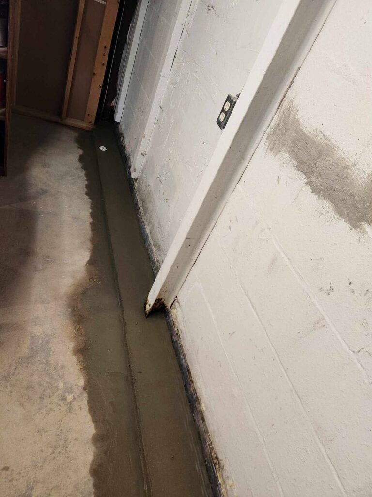 Interior basement waterproofing and foundation repair project in Menasha, WI (photo 16)