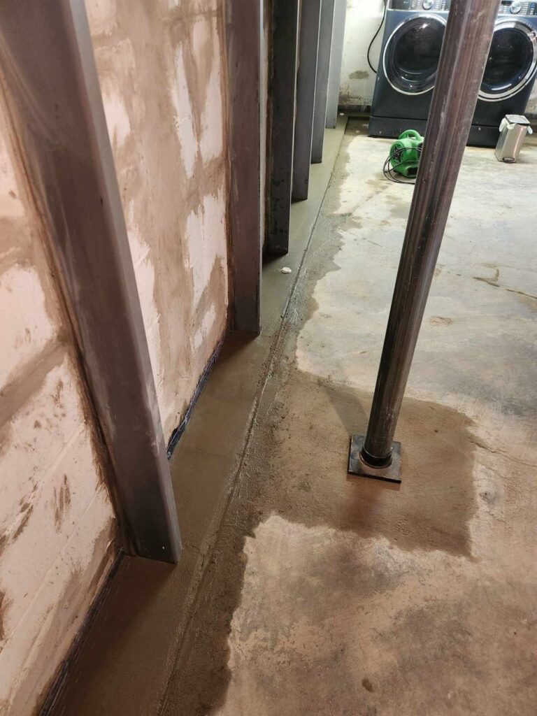 Interior basement waterproofing and foundation repair project in Menasha, WI (photo 3)