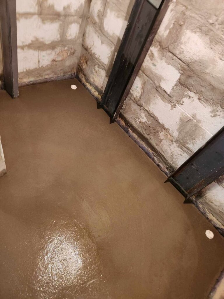 Interior basement waterproofing and foundation repair project in Menasha, WI (photo 8)