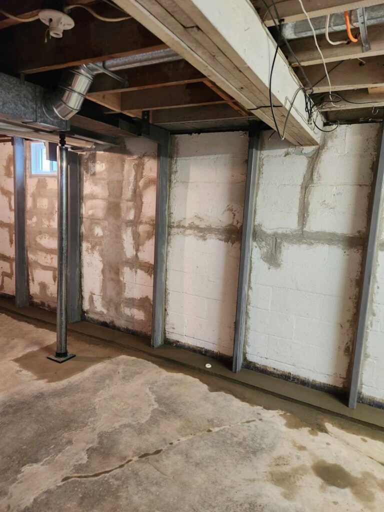 Interior basement waterproofing and foundation repair project in Menasha, WI (photo 9)
